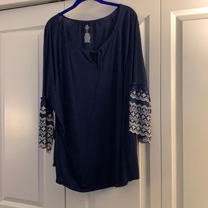 Navy blue with puffed embroidered sleeves.